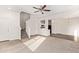 Open-concept living space with carpet and luxury vinyl plank at 909 E Agua Fria Ln, Avondale, AZ 85323
