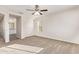 Spacious main bedroom featuring neutral carpet, ceiling fan, and ample natural light at 909 E Agua Fria Ln, Avondale, AZ 85323
