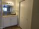 Bathroom with updated granite counters and white cabinets and a closet at 1340 N Recker Rd # 154, Mesa, AZ 85205