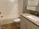 Bathroom with updated granite counters, white cabinets and tiled floors at 1340 N Recker Rd # 154, Mesa, AZ 85205