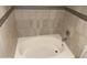 Bathtub with decorative tile surround at 1340 N Recker Rd # 154, Mesa, AZ 85205