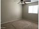 Simple bedroom offering plush carpeting, neutral walls, and bright natural light from windows at 1340 N Recker Rd # 154, Mesa, AZ 85205