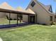 Inviting exterior featuring a covered walkway and well-manicured lawn, complemented by a unique architectural style at 1340 N Recker Rd # 154, Mesa, AZ 85205