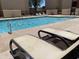 Pool with lounge chairs at 1340 N Recker Rd # 154, Mesa, AZ 85205