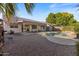 Relaxing backyard oasis featuring a private pool, patio area, and desert landscape at 1415 W Michigan Ave, Phoenix, AZ 85023