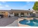 Beautiful backyard features a pool, covered patio, and ample space for entertaining at 1415 W Michigan Ave, Phoenix, AZ 85023