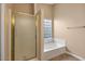 Bathroom with a shower stall and a glass block window that provides privacy and light at 1415 W Michigan Ave, Phoenix, AZ 85023