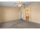 Bright bedroom featuring neutral walls, carpet, and an entrance to a bathroom at 1415 W Michigan Ave, Phoenix, AZ 85023