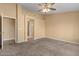 Neutral bedroom with carpet, multiple doors, and neutral paint at 1415 W Michigan Ave, Phoenix, AZ 85023