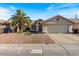Charming single-story home with a two car garage and a desert-landscaped front yard at 1415 W Michigan Ave, Phoenix, AZ 85023