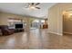 Spacious living room with tile flooring, neutral paint, and sliding glass doors to the outdoor space at 1415 W Michigan Ave, Phoenix, AZ 85023