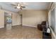 Open living area with tile flooring, neutral walls, and a view of the home's layout at 1415 W Michigan Ave, Phoenix, AZ 85023