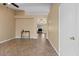 Open-concept living room featuring tile flooring and neutral paint palette at 1415 W Michigan Ave, Phoenix, AZ 85023