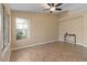 Living room with tile floor and large window providing natural light at 1415 W Michigan Ave, Phoenix, AZ 85023