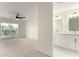 Bedroom leads into a full bath with double vanity and a sliding glass door at 1521 W Jacinto Ave, Mesa, AZ 85202