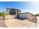 Two-story home with balcony, two car garage, and a private front yard with a block fence at 1521 W Jacinto Ave, Mesa, AZ 85202