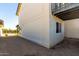 Home exterior featuring durable siding, well-kept gravel landscaping, and covered patio area at 1521 W Jacinto Ave, Mesa, AZ 85202