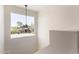 Hallway featuring a statement light fixture and a large window showcasing the exterior view at 1521 W Jacinto Ave, Mesa, AZ 85202