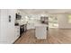 Modern kitchen with stainless appliances, island, shaker cabinets, and bright natural light at 1521 W Jacinto Ave, Mesa, AZ 85202