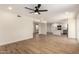 Bright, open-concept living space featuring wood floors, and a seamless transition into the modern kitchen at 1521 W Jacinto Ave, Mesa, AZ 85202