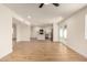 Open-concept living space showcasing wood floors, neutral walls, and seamless flow into the modern kitchen at 1521 W Jacinto Ave, Mesa, AZ 85202