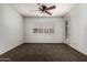 Bedroom with neutral tones, a ceiling fan, and a private door leading to the outdoor space at 162 W Raven Dr, Chandler, AZ 85286