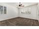 Spacious bedroom filled with natural light from shuttered windows and a ceiling fan for added comfort at 162 W Raven Dr, Chandler, AZ 85286