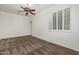 Inviting bedroom with large windows, a ceiling fan, and neutral carpet flooring at 162 W Raven Dr, Chandler, AZ 85286