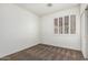 This bedroom features carpeted floors, a window with shutters, and light-colored walls at 162 W Raven Dr, Chandler, AZ 85286