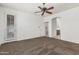 Bedroom with ensuite bathroom, a ceiling fan, and a door leading to outdoor space at 162 W Raven Dr, Chandler, AZ 85286