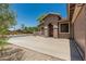 Beige single-story home featuring desert landscaping, and a wide driveway at 162 W Raven Dr, Chandler, AZ 85286