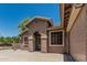 Beige single-story home featuring desert landscaping, and a wide driveway at 162 W Raven Dr, Chandler, AZ 85286