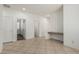 This hallway features tile flooring, light-colored walls, and several doorways at 162 W Raven Dr, Chandler, AZ 85286