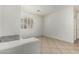 This hallway features tile flooring, a window with shutters, and light-colored walls at 162 W Raven Dr, Chandler, AZ 85286