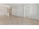 Bright living room featuring neutral tile flooring and an open archway, seamlessly blending style and space at 162 W Raven Dr, Chandler, AZ 85286