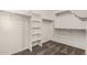 Walk-in closet equipped with shelving and hanging rods, maximizing storage efficiency at 162 W Raven Dr, Chandler, AZ 85286