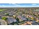 Picturesque aerial view of a suburban community with mature trees, manicured lawns and convenient access to amenities at 1673 E Laddoos Ave, Queen Creek, AZ 85140