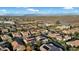 Stunning aerial view of a residential neighborhood featuring tile roofs, landscaping, and distant mountain views at 1673 E Laddoos Ave, Queen Creek, AZ 85140