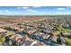 Expansive aerial view of a community surrounded by open land, showcasing a peaceful and spacious living environment at 1673 E Laddoos Ave, Queen Creek, AZ 85140