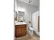 Bathroom featuring a vanity with sink, toilet, shower curtain, mirror, and cabinet at 1673 E Laddoos Ave, Queen Creek, AZ 85140