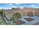 Charming single-story home with a tile roof, landscaped front yard, and walkway leading to the entrance at 1673 E Laddoos Ave, Queen Creek, AZ 85140