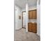 Hallway area featuring built in cabinetry and a large mirror on the wall at 1673 E Laddoos Ave, Queen Creek, AZ 85140
