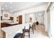 Spacious kitchen features an extended white countertop island, custom cabinets, and modern appliances at 1673 E Laddoos Ave, Queen Creek, AZ 85140