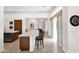 Bright, open kitchen with a large island, bar seating, and modern finishes offering an inviting space at 1673 E Laddoos Ave, Queen Creek, AZ 85140