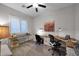 Bright office space with a ceiling fan, carpet, and multiple desks with window views at 1673 E Laddoos Ave, Queen Creek, AZ 85140