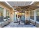 Cozy covered patio offers outdoor dining with umbrella, adjacent to a well-maintained garden at 1673 E Laddoos Ave, Queen Creek, AZ 85140