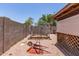Spacious backyard with gravel, metal frame greenhouse, and cozy gazebo area, ideal for outdoor activities at 18217 N 34Th Ave, Phoenix, AZ 85053