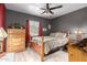 Dark bedroom featuring neutral bedding, wood furniture, natural light, and a calm, restful space at 18217 N 34Th Ave, Phoenix, AZ 85053