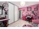 Fun bedroom design, features closet, pink walls, bright light, and playful touches throughout at 18217 N 34Th Ave, Phoenix, AZ 85053