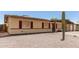 Cozy single-level home featuring red-trimmed windows and xeriscaping in the front yard for water conservation at 18217 N 34Th Ave, Phoenix, AZ 85053